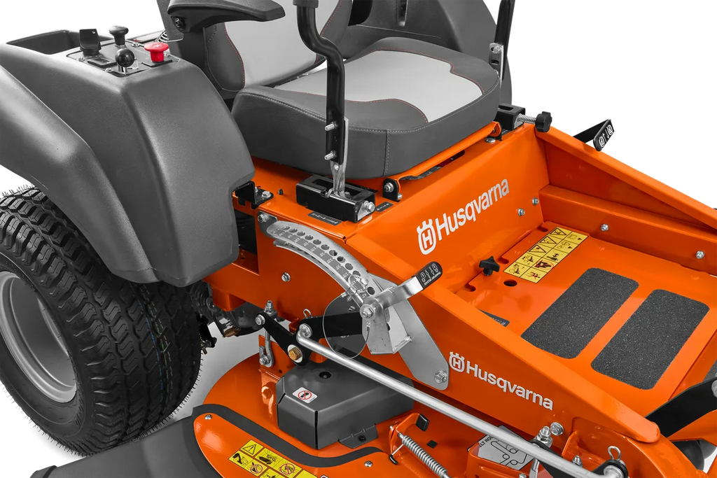Close-up of an orange Husqvarna riding lawn mower on a white background