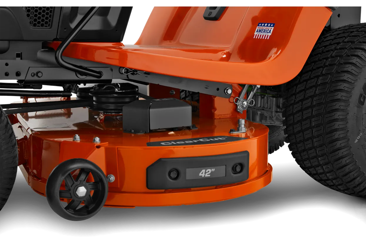 Close-up of an orange lawn mower with 'ClearCut' branding on a white background