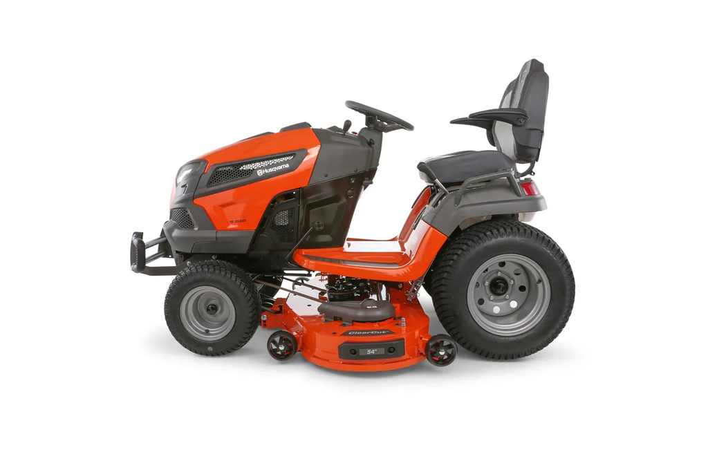 Orange and black riding lawn mower on a white background